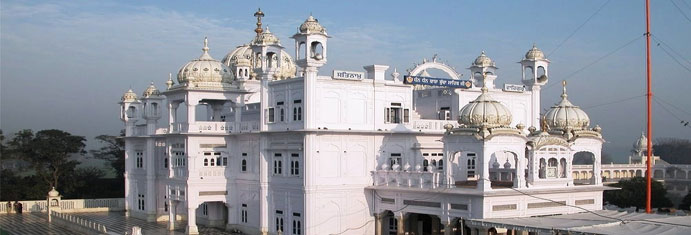 Amritsar to Baba Buddha Sahib Ji Tempo Traveller